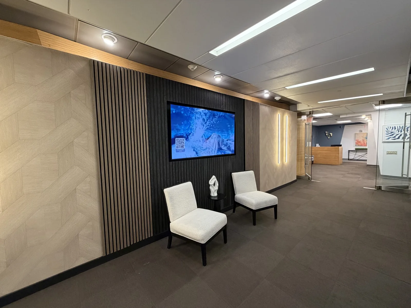 2nd floor lobby and reception area where visitors check in after exiting the elevator